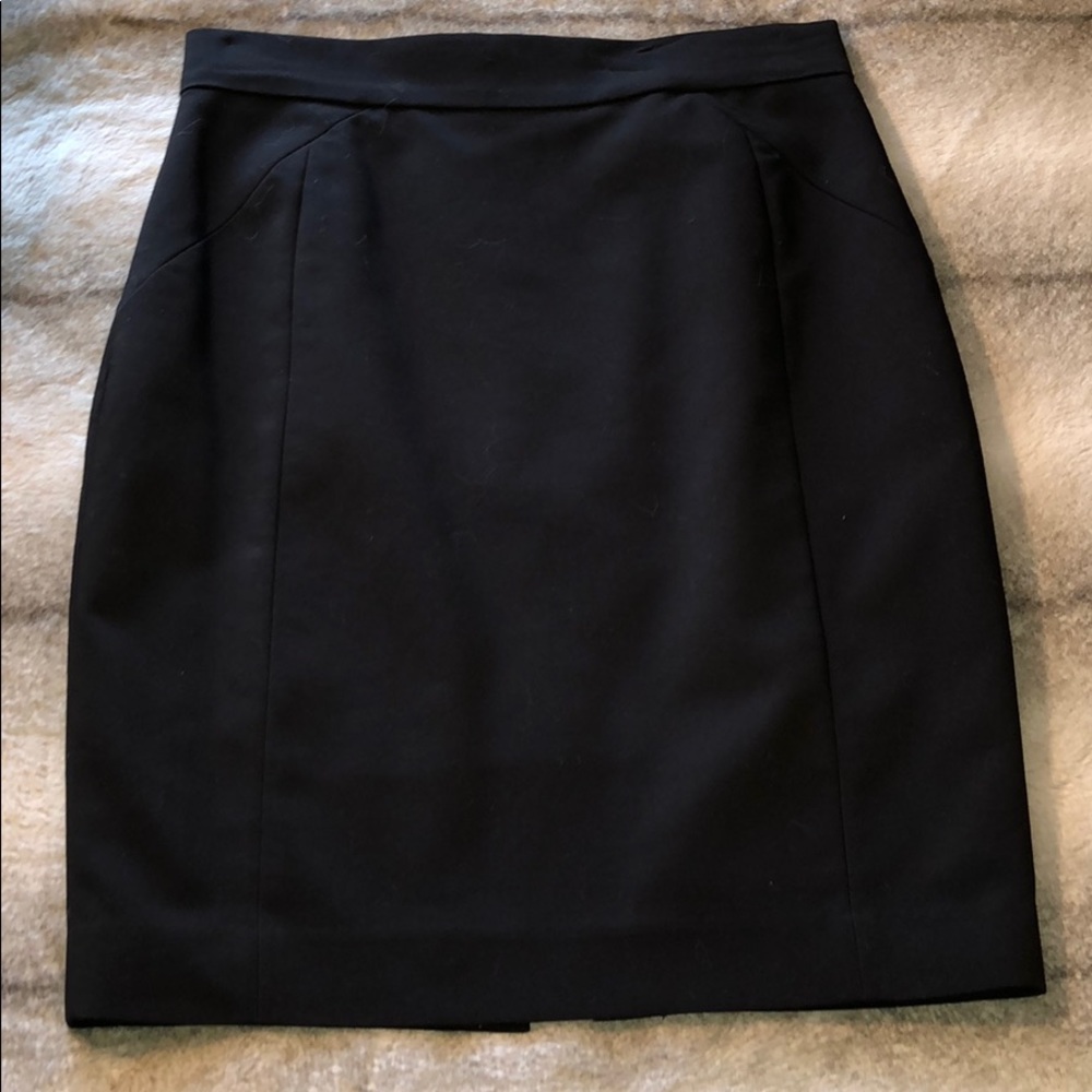 H & M Skirt, lined and has a slit in the back.